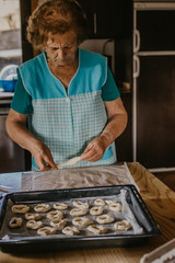 lady or grandmother preparing christmas candy or cakes