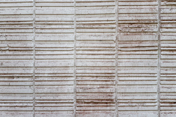 Abstract weathered texture stained old stucco light gray and aged paint white brick wall background. Brick wall may used as background.