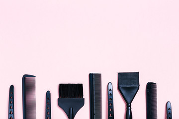 Combs and bleach brushes on pastel colored paper