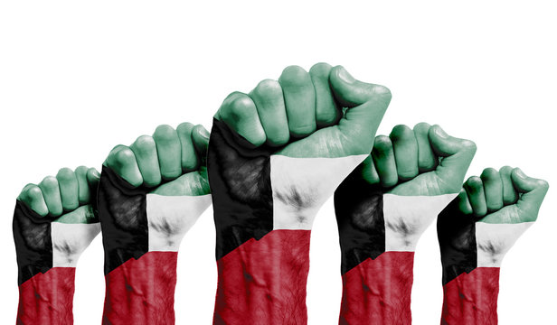 A raised fist of a protesters painted with the Kuwait flag
