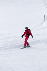 Fototapeta na wymiar Snowboarder on snowy ski slope