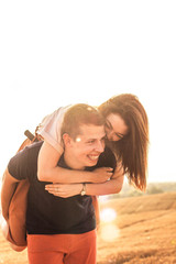 Fototapeta premium married couple walking in the field