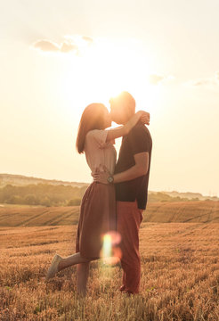 Married Couple Walking In The Field