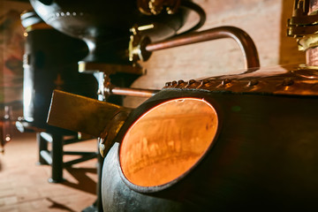 Detalis of medieval traditional distiller cube made from copper production of alcohol, cognac,...