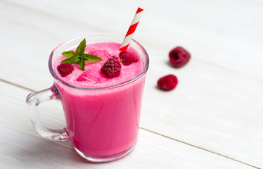 Raspberry smoothie in a decorated glass