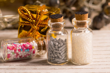 Glass bottles with sweet sprinkles for the Christmas bakery