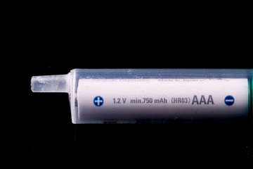 Syringe with battery energy saver on black