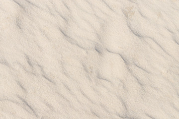 Fototapeta na wymiar White quartz sand texture, sandy beach