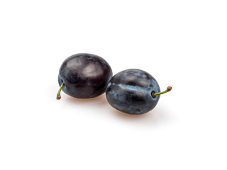 Two organic purple plums on a white background.