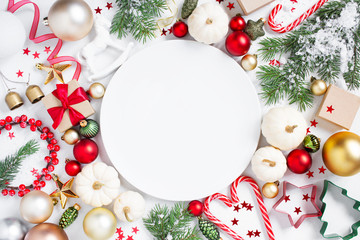 Christmas or New Year festive background with empty white plate and Christmas decoration