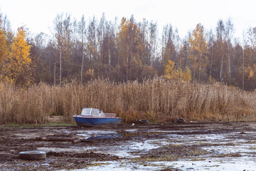 motor boat by the river, autumn