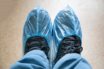 Shoe covers worn on shoes. Using Shoe covers in the hospital.