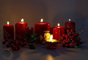 Christmas decoration. Red candles and Christmas ornaments