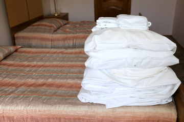 Pile of bedding on bed
