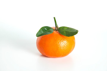 Close up image of one juicy organic whole tangerine with green leaves & visible zest texture, isolated white background, copy space. Macro shot of single bright citrus fruit. Top view, flat lay.