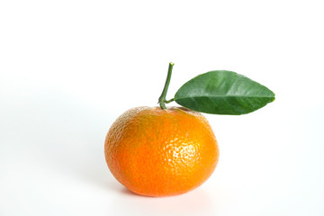 Close up image of one juicy organic whole tangerine with green leaves & visible zest texture, isolated white background, copy space. Macro shot of single bright citrus fruit. Top view, flat lay.