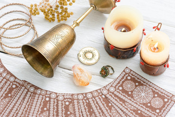 Tarot cards and golden goblet on white table of fortune teller. Divination. Future reading concept.