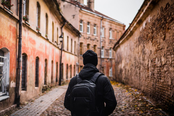man walking at vilnius old town, lithuania