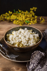 Fusilli pasta with cottage cheese, sugar and cinnamon.