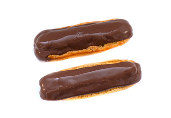 French Eclair with Chocolate brown Glaze. Eclairs with Custard isolated on white Background, top View
