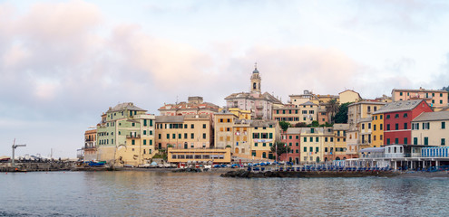 Fototapeta premium Colorful old houses in Bogliasco, beach and pier, Italy