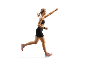 Fit young woman running with raised arm