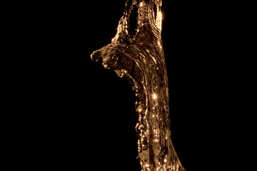 jet of oil on a black background