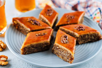 walnut baklava with glasses of tea