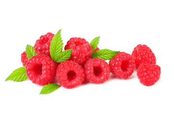 ripe raspberries with green leaves isolated on white background