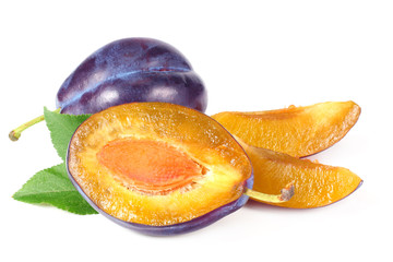 fresh plum fruit with green leaf and cut plum slices isolated on white background