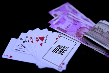 Royal Flush Playing Cards and Indian Currency Rupee bank notes