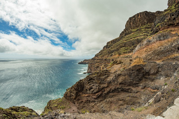View from Punta de Avalo. In the background: lighthouse San Cristobal on Punta del Faro, located on a high rocky cliff in the vicinity of the capital of the island of La Gomera, Canary Islands
