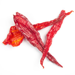 Dried hot red pepper on a white background. Food and spices.