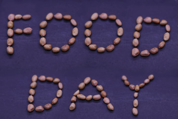 Peanuts with World Food Day text on black background. World Food Day