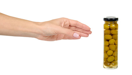 Glass jar with green olives. Canning supply food.