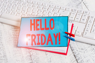 Handwriting text Hello Friday. Conceptual photo used to express happiness from beginning of fresh week notebook paper reminder clothespin pinned sheet white keyboard light wooden