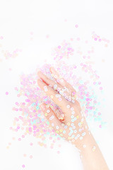 Pearl pastel confetti sparkles with woman hand