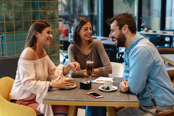 Friends hang out in a cafe