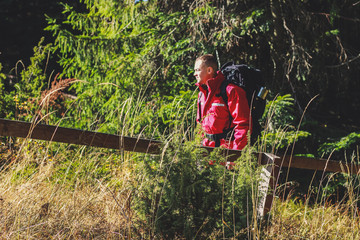 Girl and man hikers in mountains. Travel backpacks and clothing. Campaign. Ukrainian Carpathian Mountains. Traveling in Ukraine.