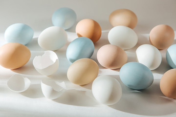 Natural Colored Eggs with sunlights. Compositions in pastel colors. Easter consept.  Flat lay, top view