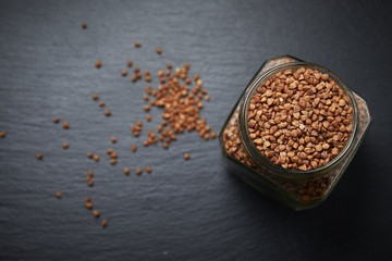 buckwheat in a jar close-up on a dark background