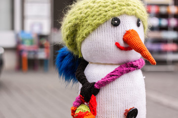 knitted snowman smiling