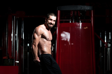 Fototapeta na wymiar Man In Gym Showing His Well Trained Body