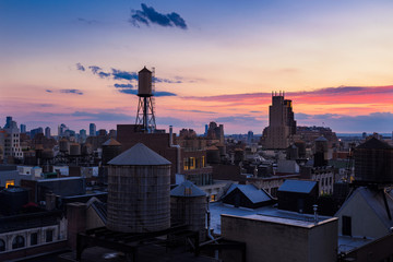 Chelsea rooftops at twilight with water towers. Manhattan, New York City, NY, USA