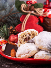 Traditional Christmas cookies biscuits snowballs covered icing sugar povder with almond nut, nutella chocolate an raspberry jam. Christmas New Year ornament decorations.