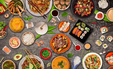 Asian food background with various ingredients on rustic stone background , top view. Vietnam or Thai cuisine.
