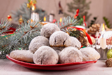 Traditional Christmas almond chocolate snowballs cookies biscuits covered icing sugar powder. Russian Tea Cakes, Mexican Wedding Cookies, Butterballs. Christmas New Year festive ornament decorations.