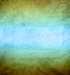 Close-up of blue and green grunge textured paper background