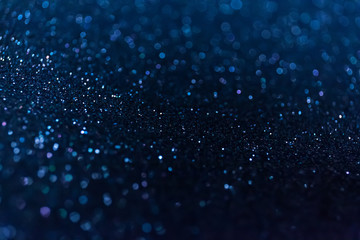 Abstract glitter shining lights background. De-focused lights