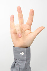 Male hands with raised fingers on a white background